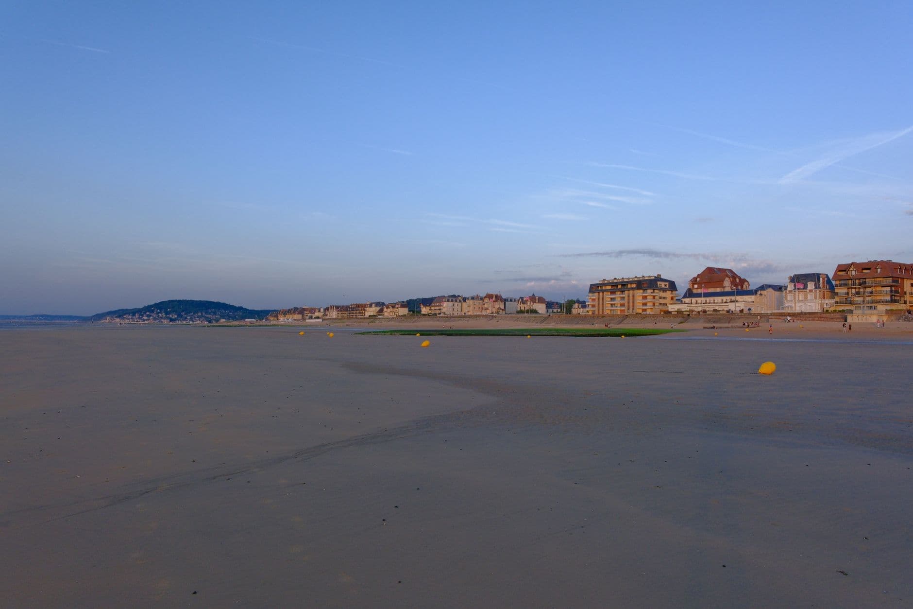 Peaceful evening view of Cabourg beach and architecture in Normandy, France.
