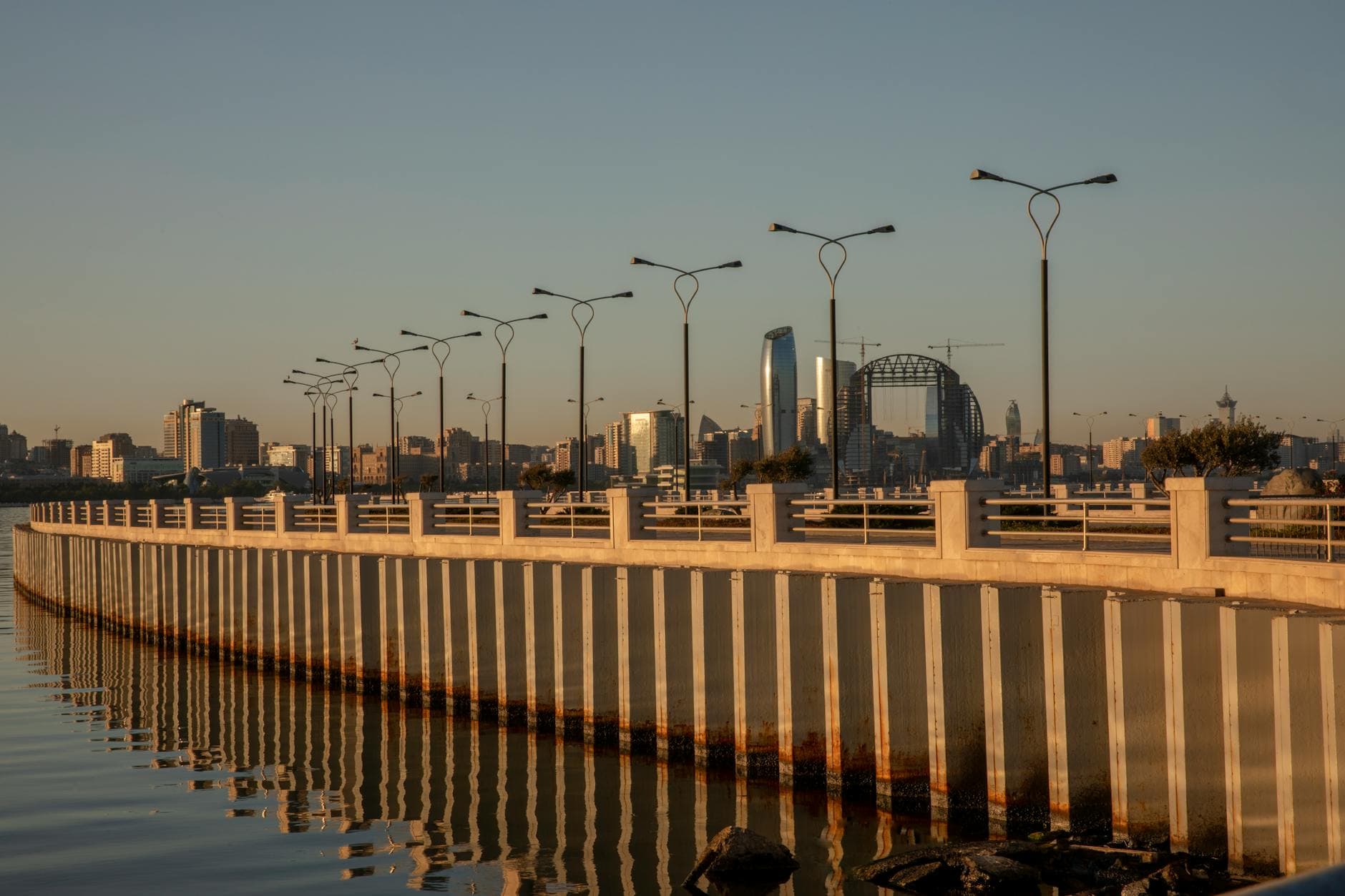 Modern architecture and city skyline reflected in the waterfront in Baku, Azerbaijan.