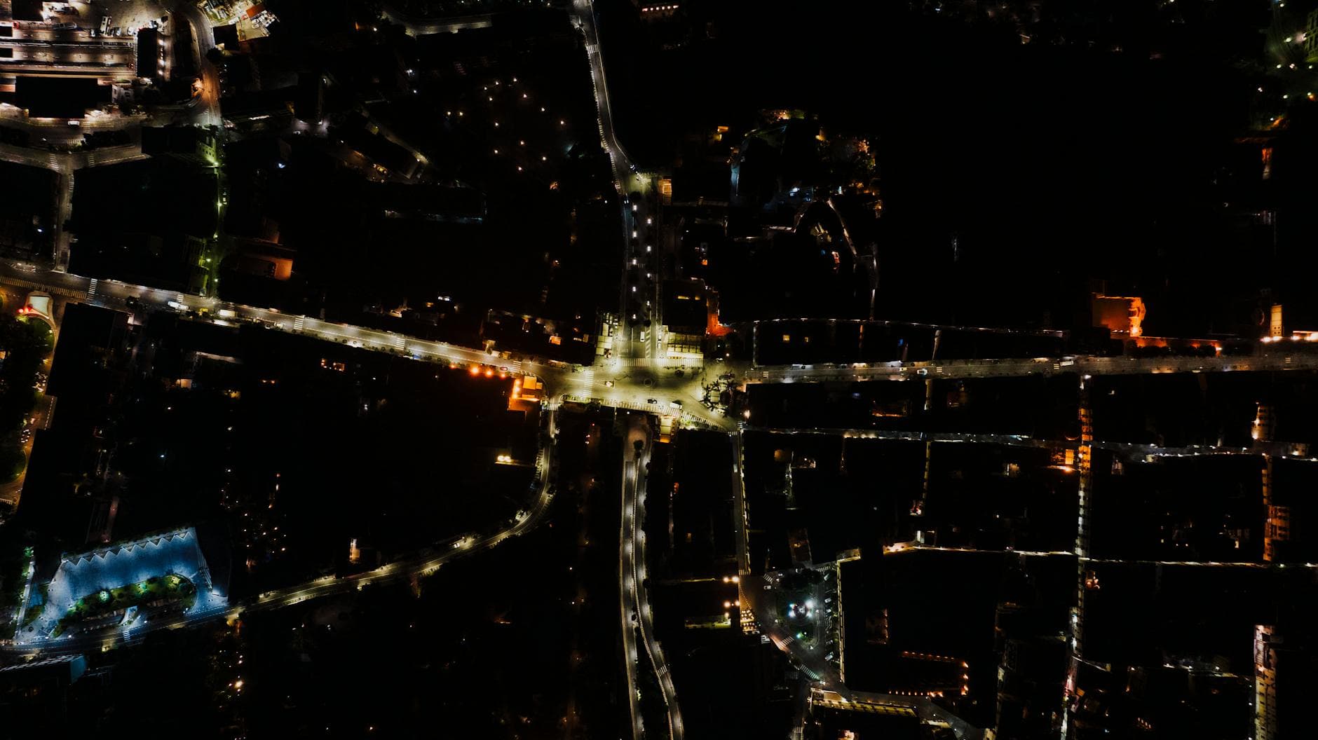 Stunning aerial night view of the illuminated streets of Sorrento, Italy.