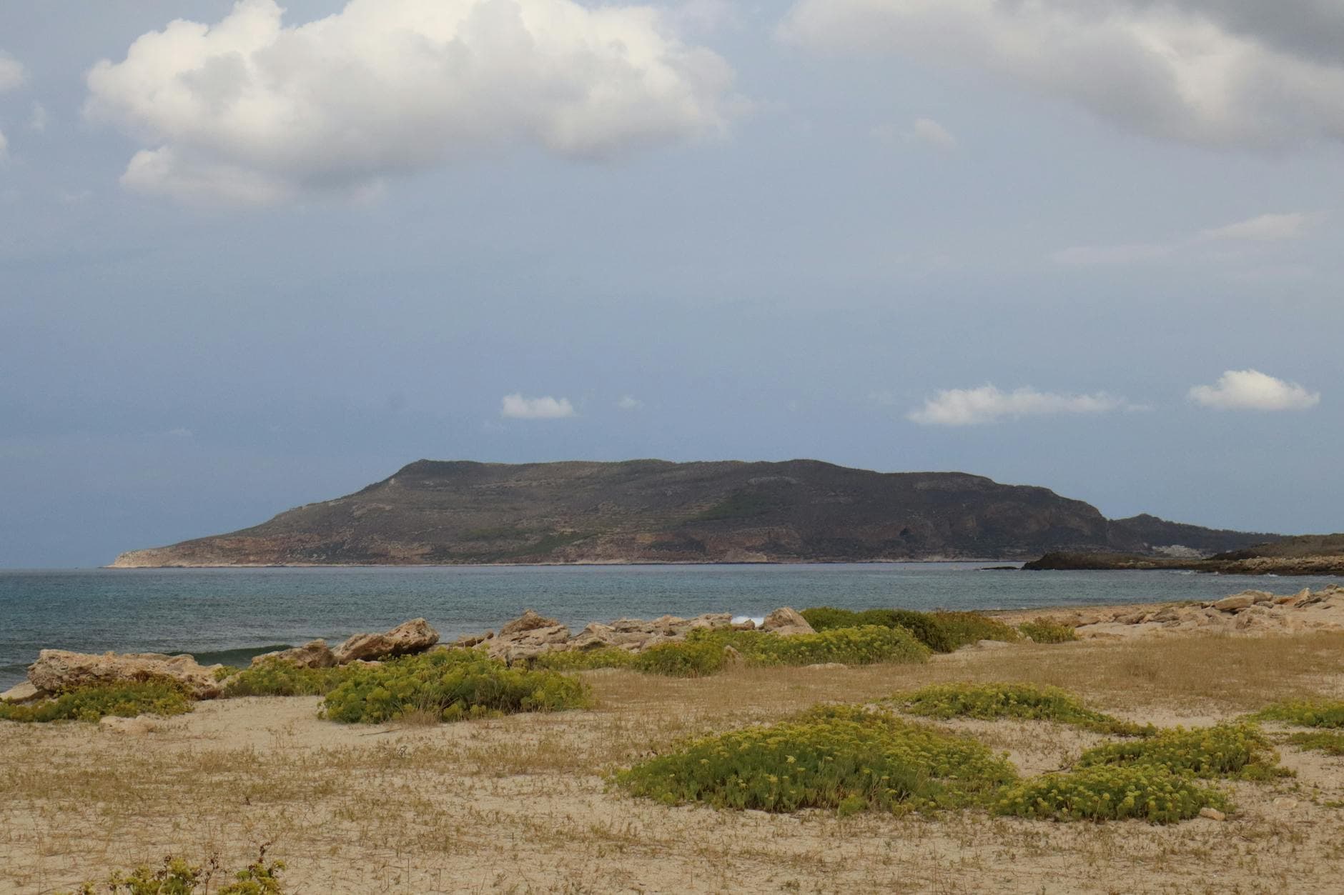 Peaceful seascape with scenic views of the Sicilian coast, featuring natural beauty and serene surroundings.