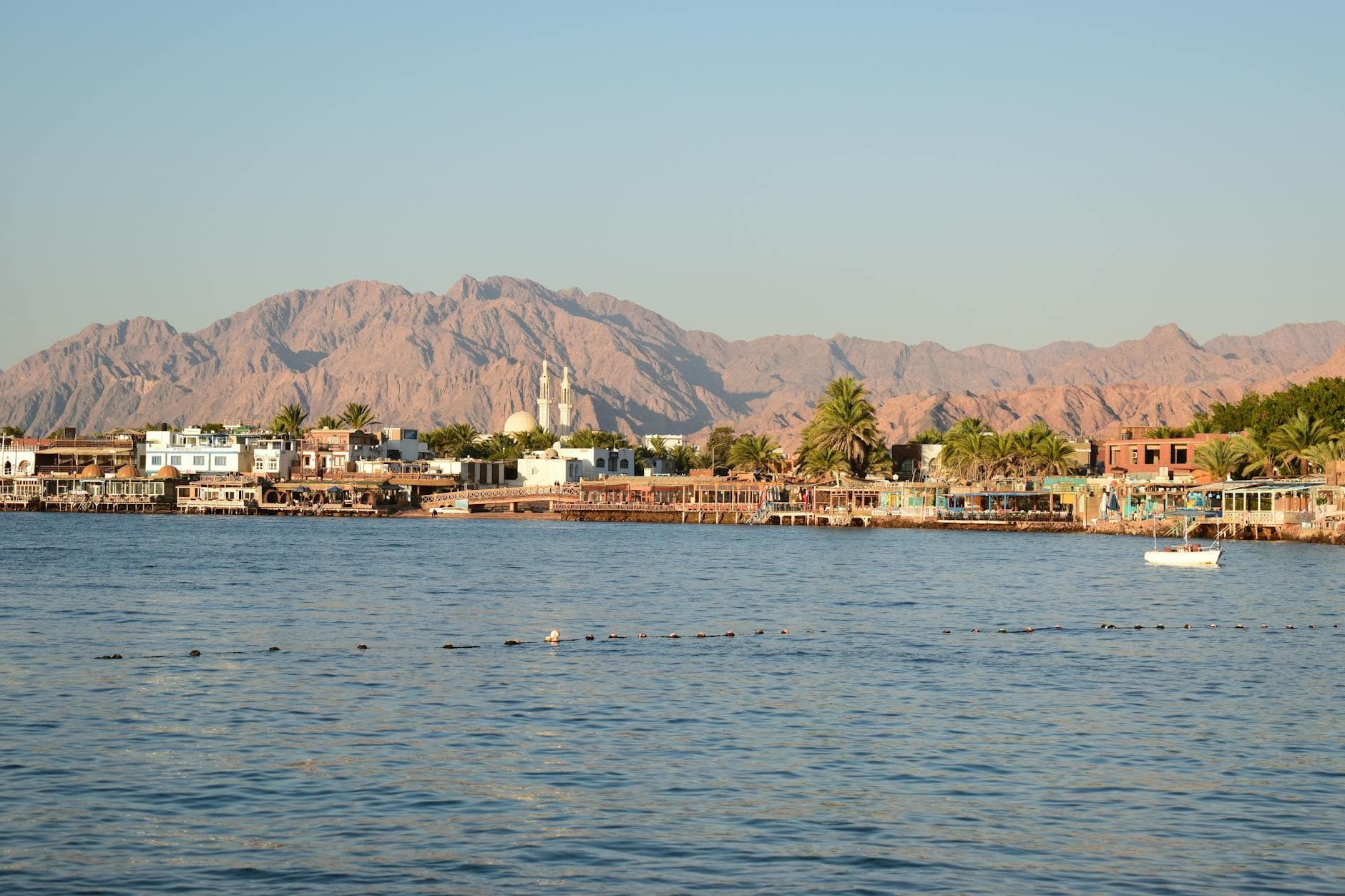 Stunning view of Dahab townscape against Sinai mountains, Egypt's coastal charm.