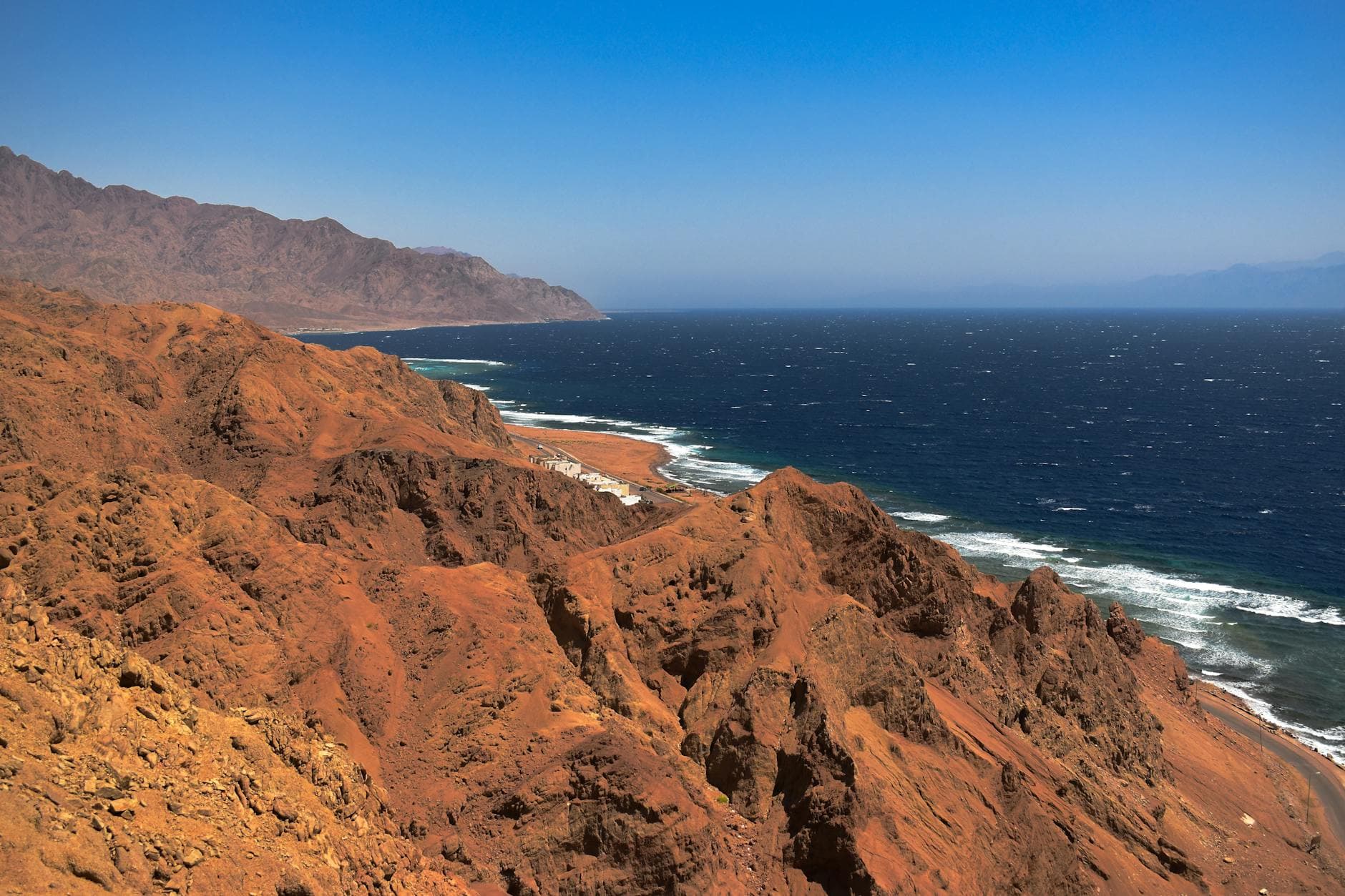 Breathtaking view of the rugged cliffs along the Red Sea coast in Dahab, South Sinai, Egypt.
