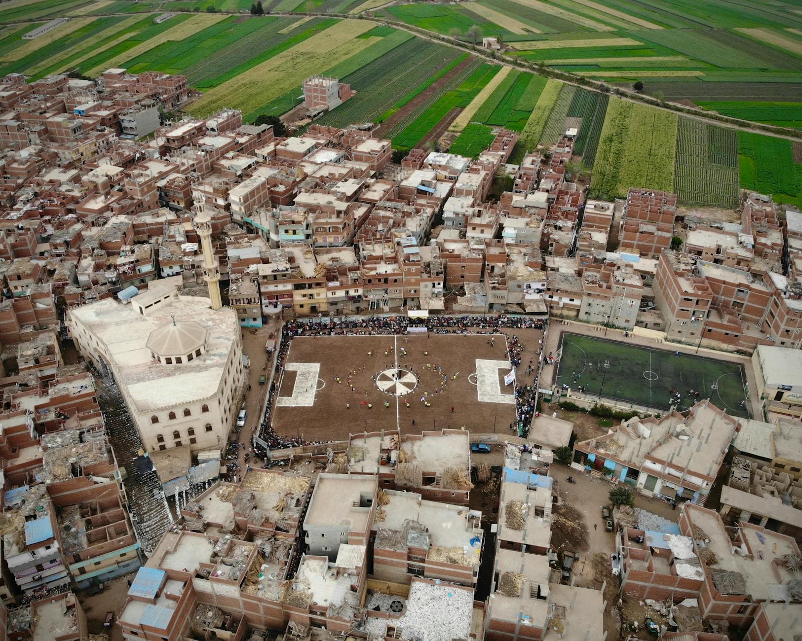 Aerial view of Qashtoukh town highlighting residential buildings and farmland in Menofia, Egypt.