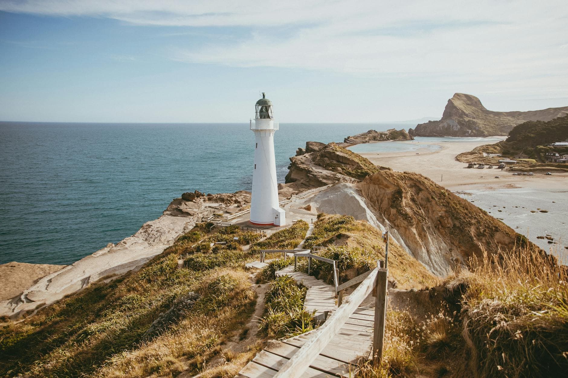 A picturesque view of Castlepoint lighthouse on the North Island's coast in New Zealand.