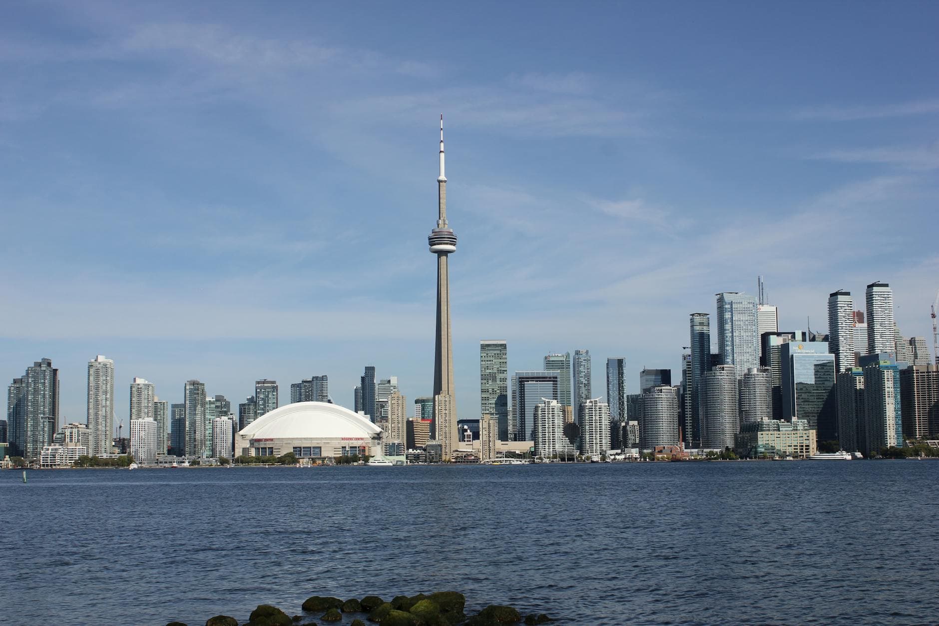 View of Toronto's skyline featuring the CN Tower and Skydome from across the waterfront.