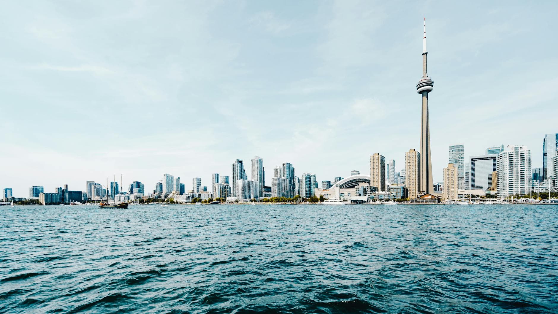 Beautiful daytime view of Toronto's skyline with CN Tower and waterfront.