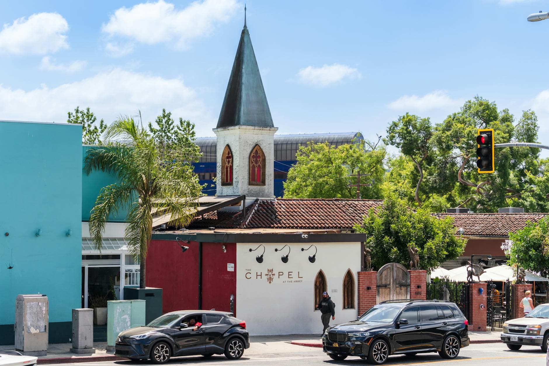 Street view of The Chapel at The Abbey in West Hollywood, showcasing vibrant architecture and lively atmosphere.