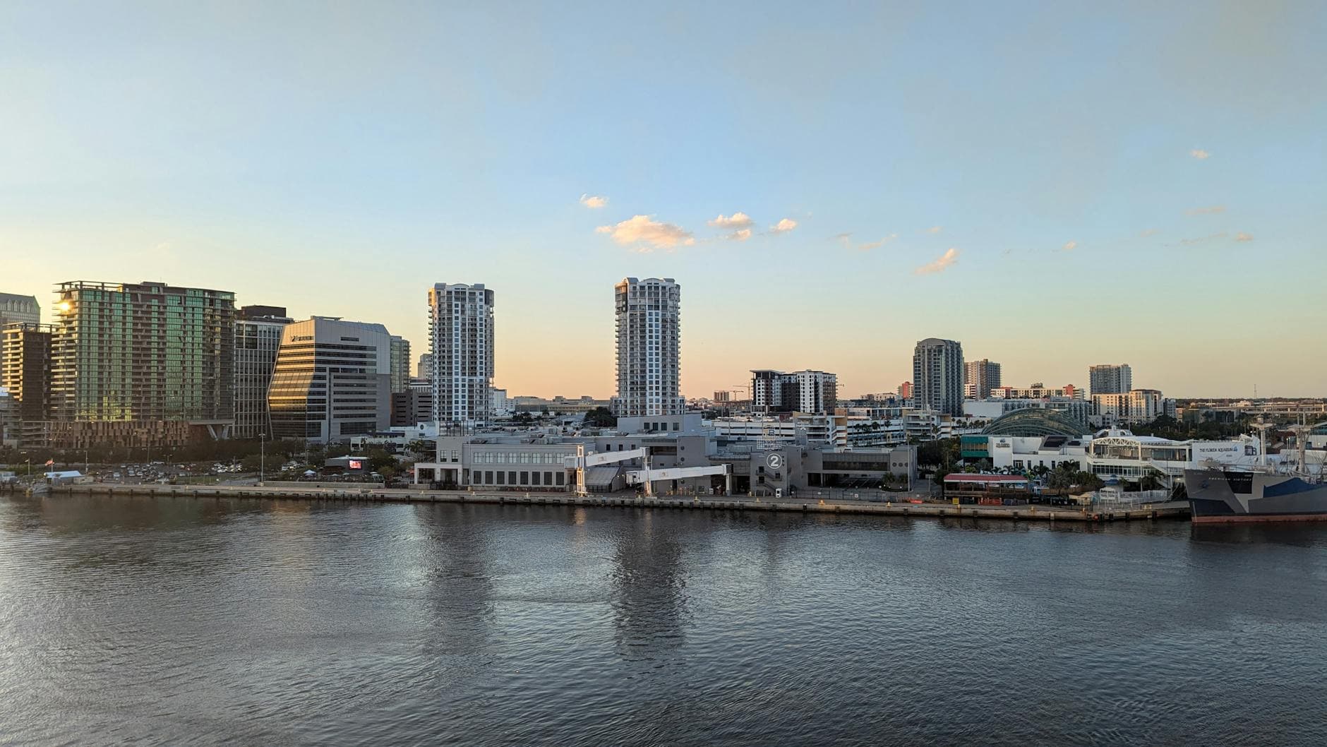 Stunning view of Tampa Bay skyline at dusk, reflecting on the calm waters.