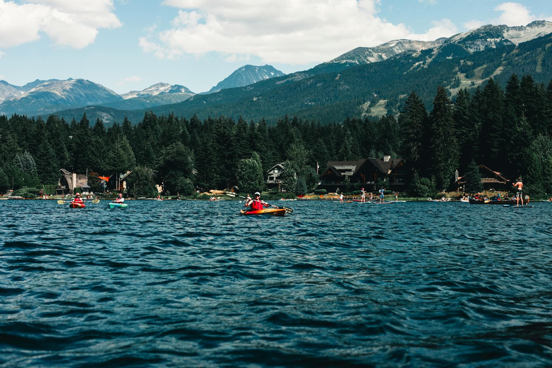 Scenic kayaking on a lake with mountain views in Whistler, BC, Canada.