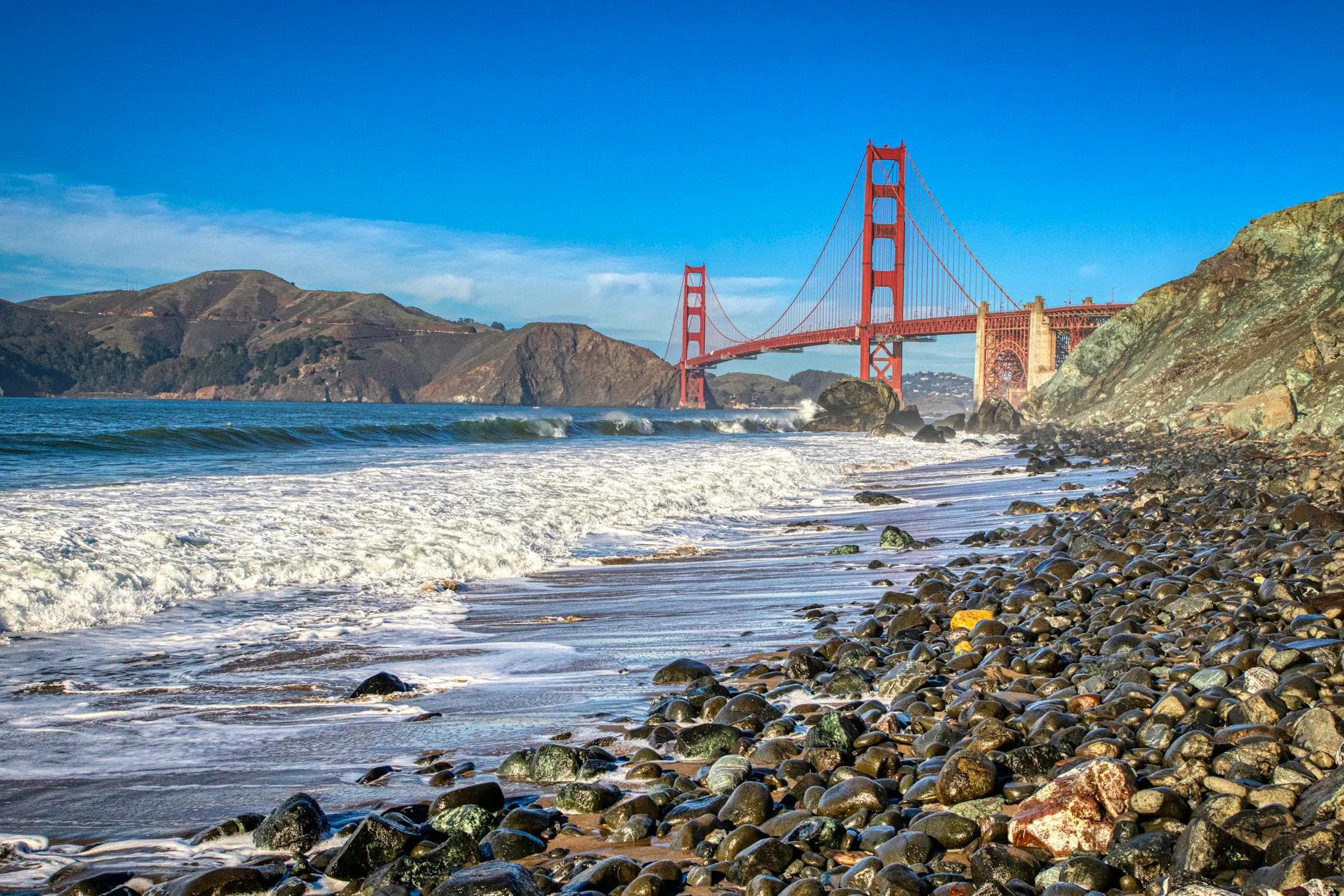 Scenic view of the Golden Gate Bridge from Marshall Beach on a clear day in San Francisco.