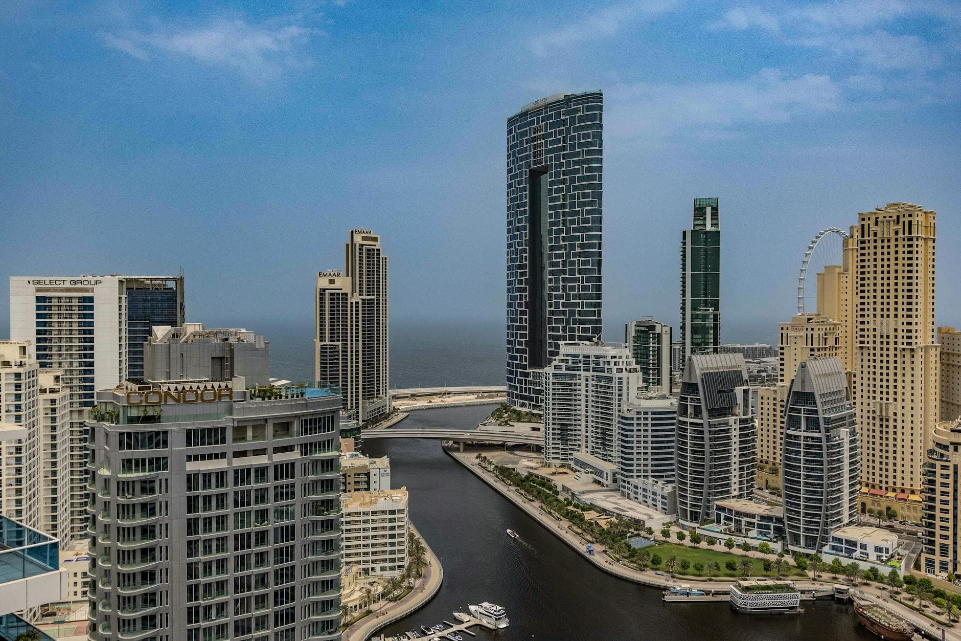 A breathtaking aerial view of Dubai Marina skyline with towering skyscrapers and beautiful canal.
