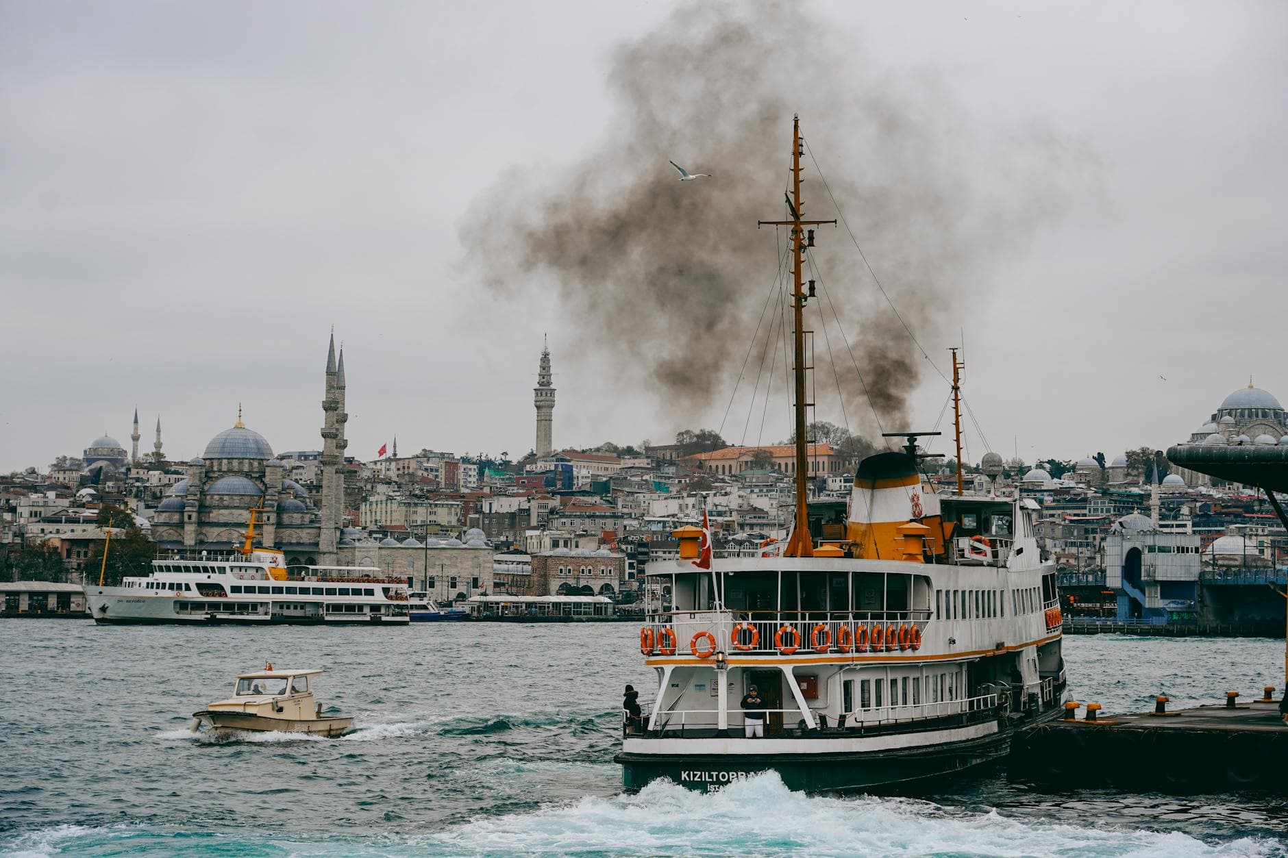 A picturesque view of Istanbul's harbor showcasing historic architecture and busy waterways with iconic ships.