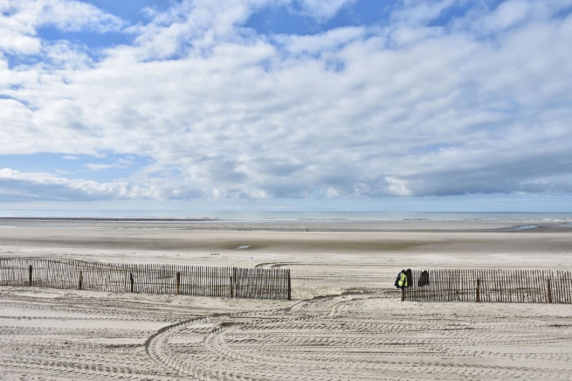 Beautiful sandy beach with cloudy sky at Le Touquet-Paris-Plage in France.