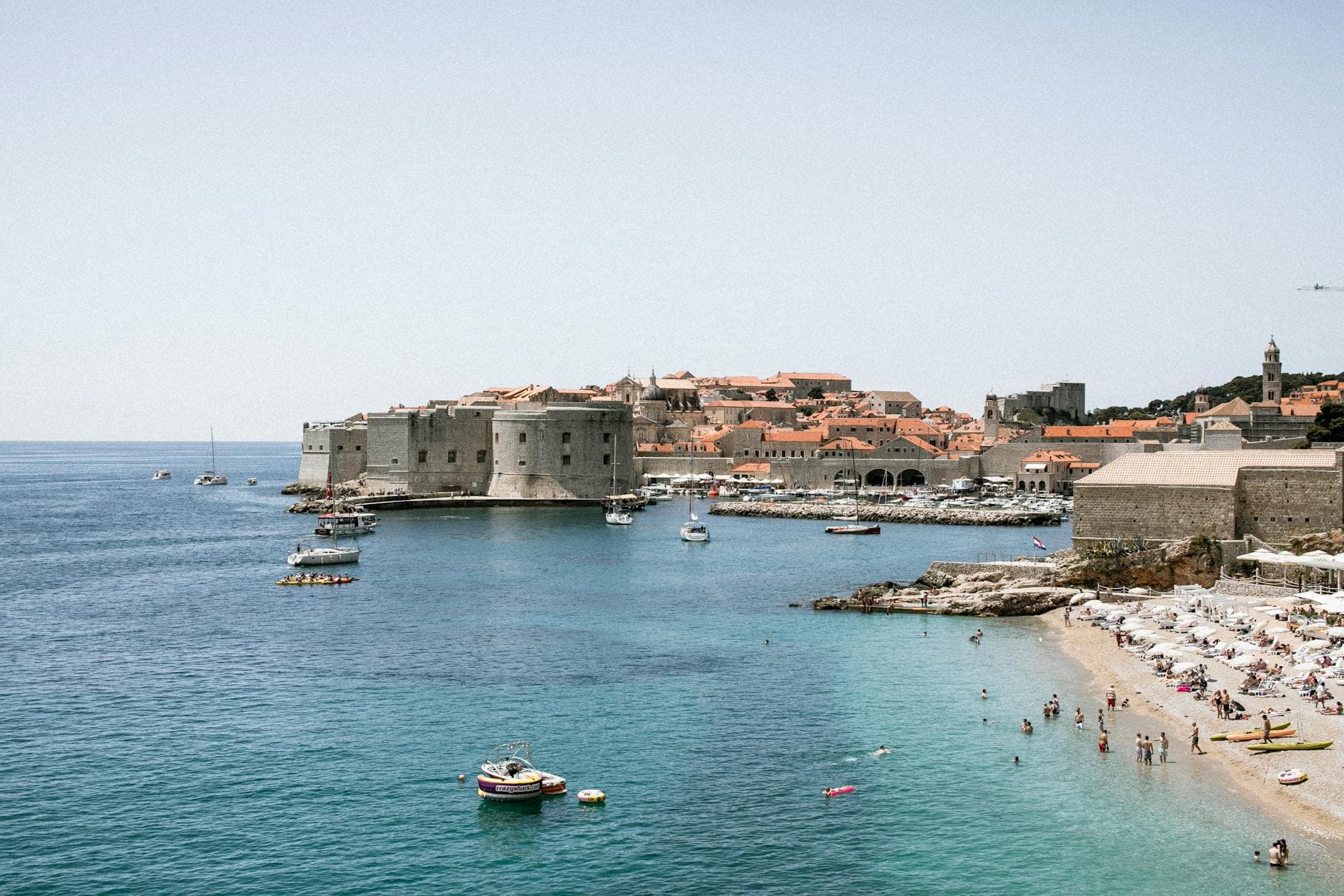 Beautiful view of Dubrovnik's coastline and historic fortress, an iconic UNESCO heritage site.