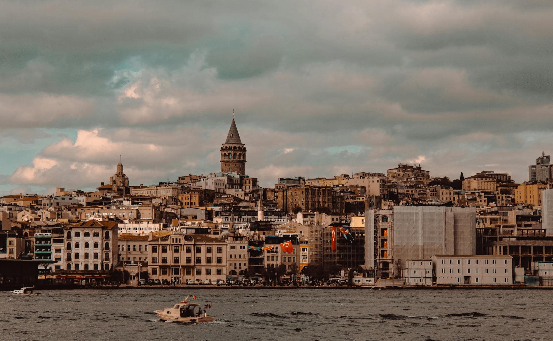 Beautiful view of Istanbul's skyline featuring Galata Tower and waterfront at sunset.