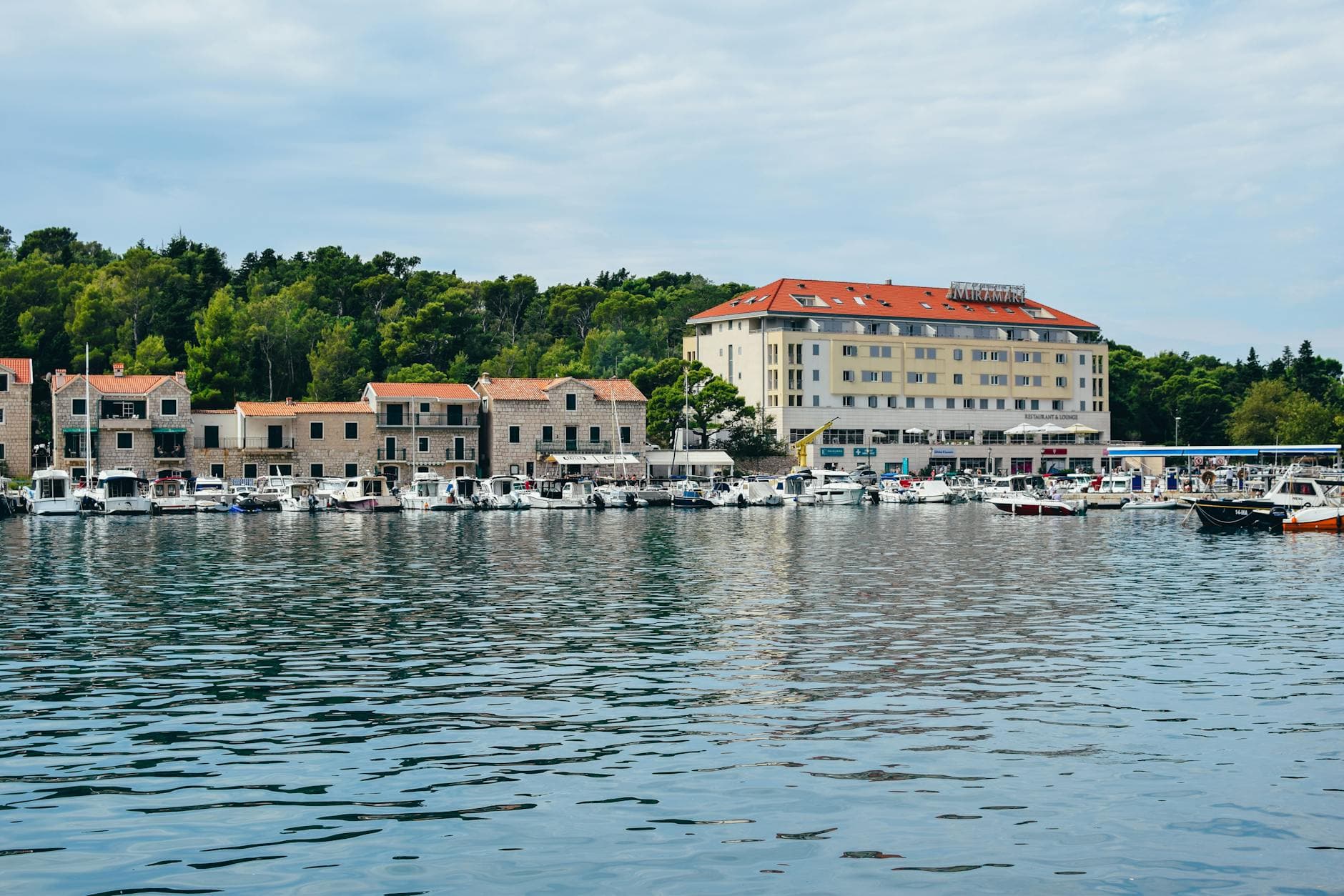 Picturesque view of Makarska's waterfront with boats and historic buildings.
