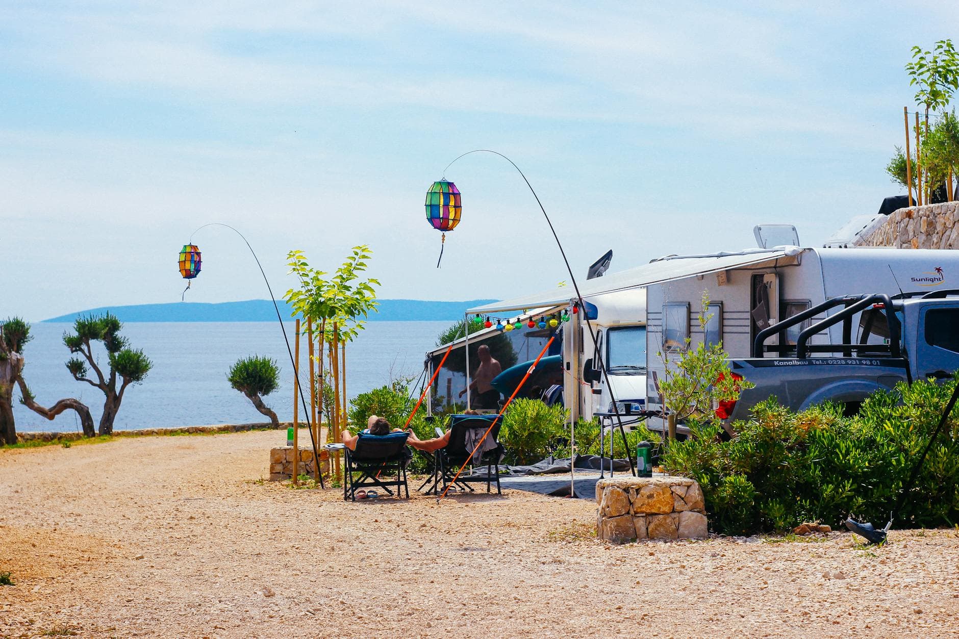 Relaxing RV camping with vibrant lanterns and sea view in Novalja, Croatia.