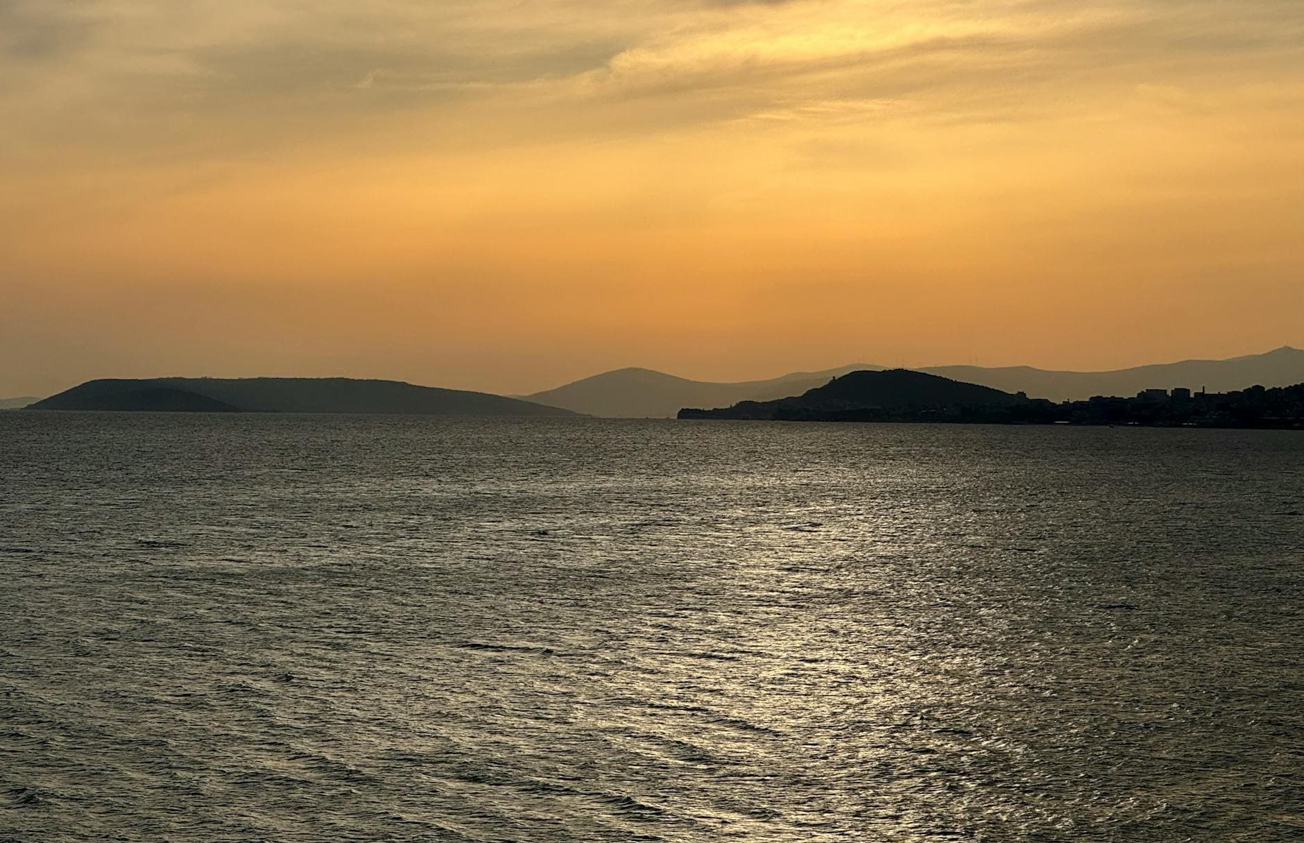 Tranquil Adriatic Sea at sunset viewed from Podstrana, Croatia. A serene coastal landscape.