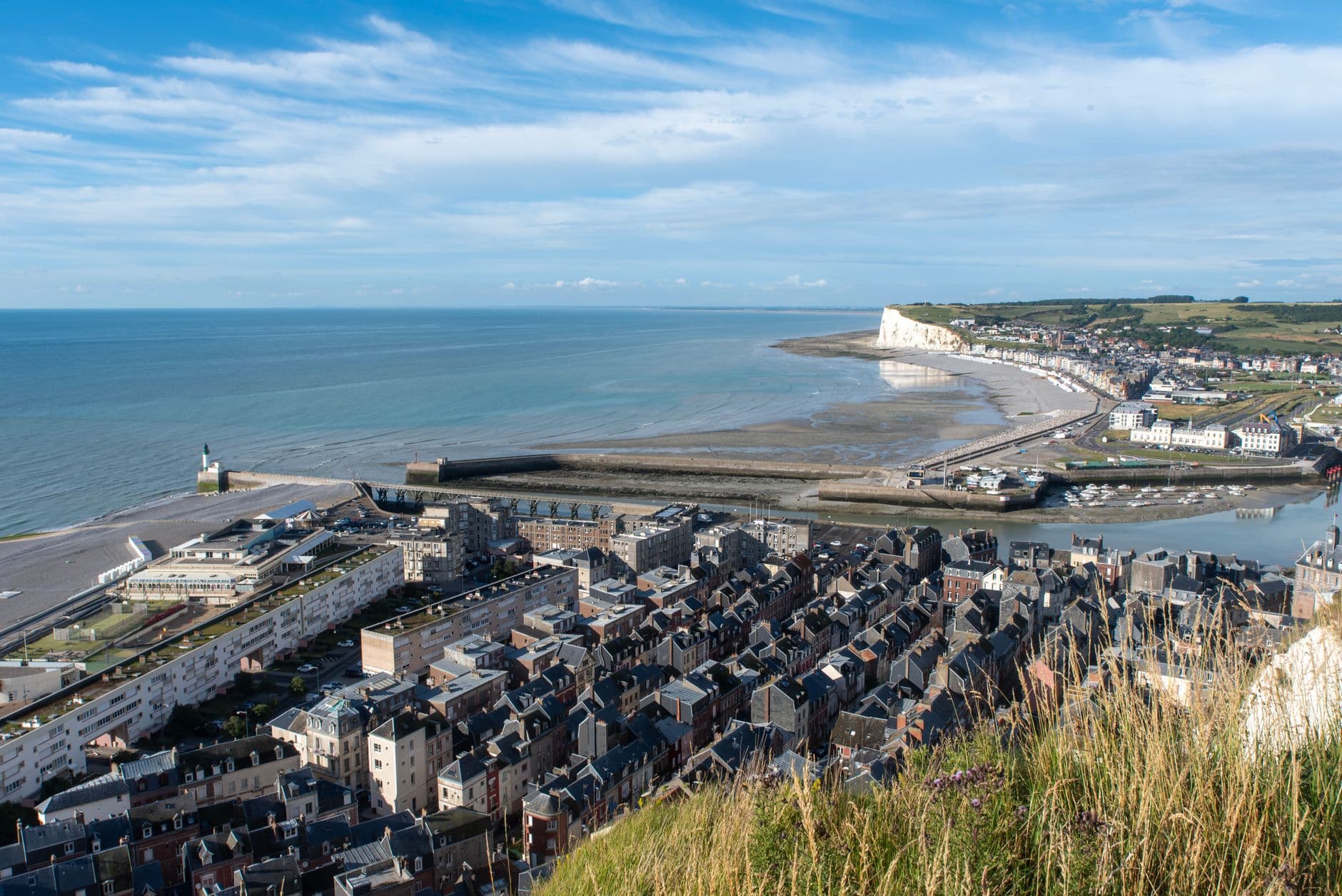 Aerial view of Le Tréport, France showcasing the stunning coastline, harbor, and town.